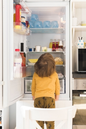 cute-boy-looking-into-tall-fridge.jpg